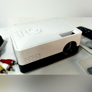 Portable LED Projector with remote. Small, White, Lightweight, Great Picture.